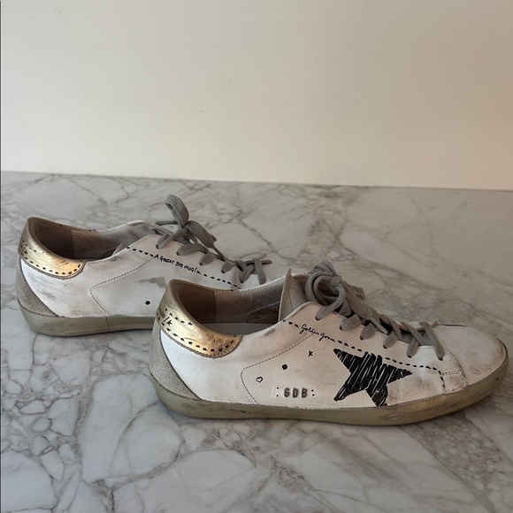 Golden Goose White Sneakers with Gold and Black Accents - Picture 1 of 4